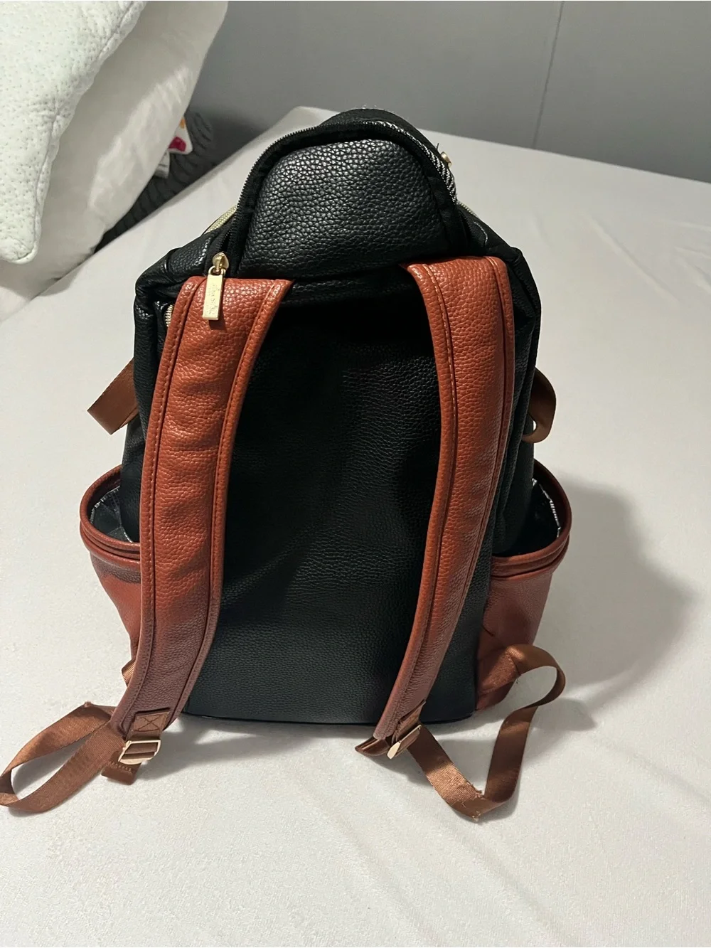 Itzy Ritzy Baby Diaper Bag Backpack in Black, White, brown with wipes case